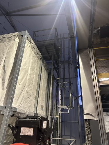 silo with safety cage ladder and maintenance walkway