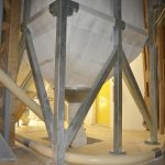 Tubular screw conveyor for fabric silo