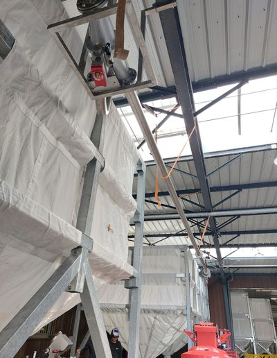 Transfer screws and flexible storage silos