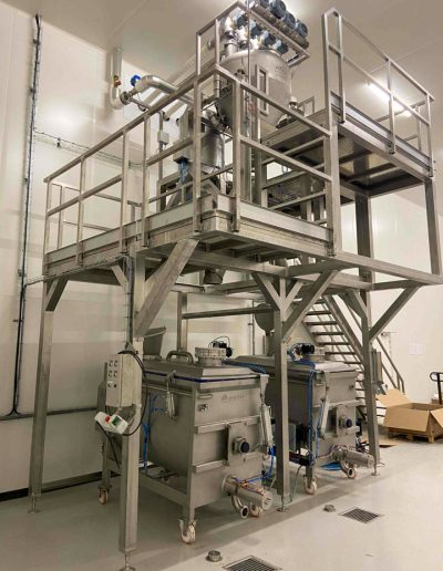 Maintenance walkway for dosing station with hot water tank.