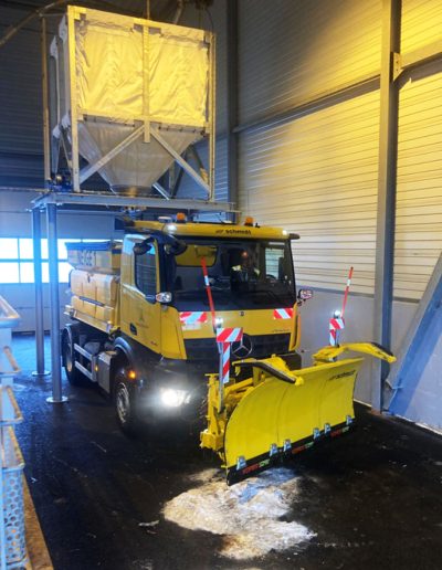 Snow clearance lorry filling up with salt
